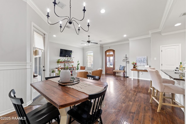 710 Highland View Dr, Youngsville, LA 70592 - dining area featuring wood finished floors, arched walkways, a chandelier, ornamental molding, and recessed lighting