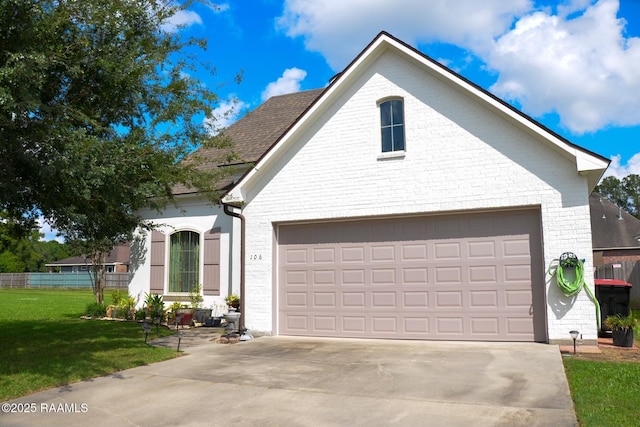 106 Camry Dr, Lafayette, LA 70503 - traditional home featuring brick siding, a garage, and concrete driveway