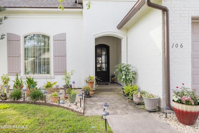 106 Camry Dr, Lafayette, LA 70503 - doorway to property with roof with shingles and brick siding