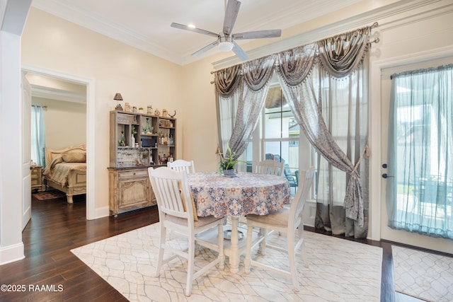 106 Camry Dr, Lafayette, LA 70503 - dining area featuring crown molding, ceiling fan, dark wood-type flooring, and baseboards