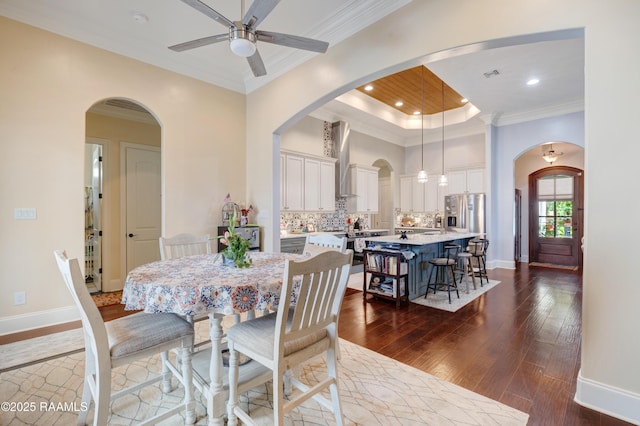 106 Camry Dr, Lafayette, LA 70503 - dining space featuring dark wood-style flooring, ceiling fan, crown molding, recessed lighting, and baseboards
