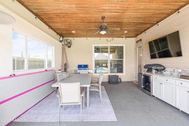 105 Hazy River Way, Lafayette, LA 70508 - view of patio with beverage cooler, ceiling fan, and outdoor dining area