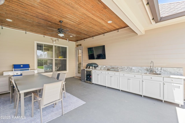 105 Hazy River Way, Lafayette, LA 70508 - view of patio with a sink, exterior kitchen, a ceiling fan, beverage cooler, and outdoor dining space