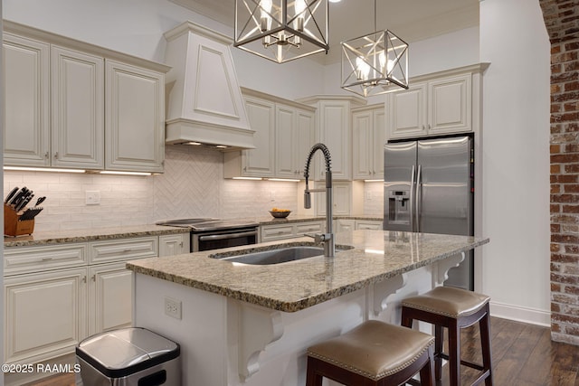 105 Hazy River Way, Lafayette, LA 70508 - kitchen featuring a sink, dark wood-style flooring, stainless steel appliances, custom range hood, and decorative backsplash