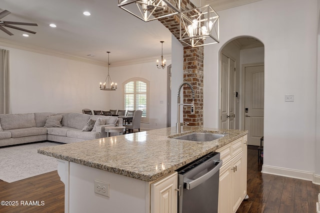 105 Hazy River Way, Lafayette, LA 70508 - kitchen featuring stainless steel dishwasher, a sink, a chandelier, arched walkways, and open floor plan