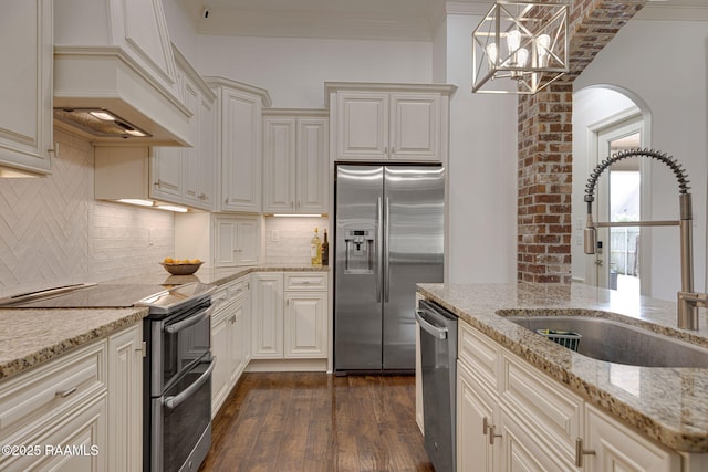 105 Hazy River Way, Lafayette, LA 70508 - kitchen with stainless steel appliances, a sink, dark wood-style flooring, custom exhaust hood, and light stone counters