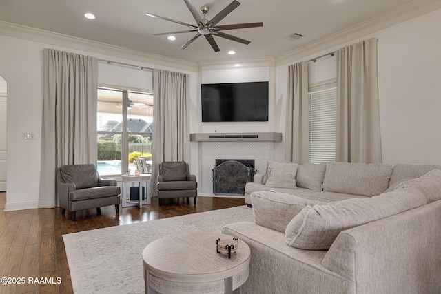 105 Hazy River Way, Lafayette, LA 70508 - living room featuring ornamental molding, ceiling fan, a tile fireplace, dark wood-style flooring, and recessed lighting