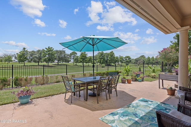 102 Capilano Ln, Broussard, LA 70518 - fenced backyard featuring a patio area and outdoor dining space