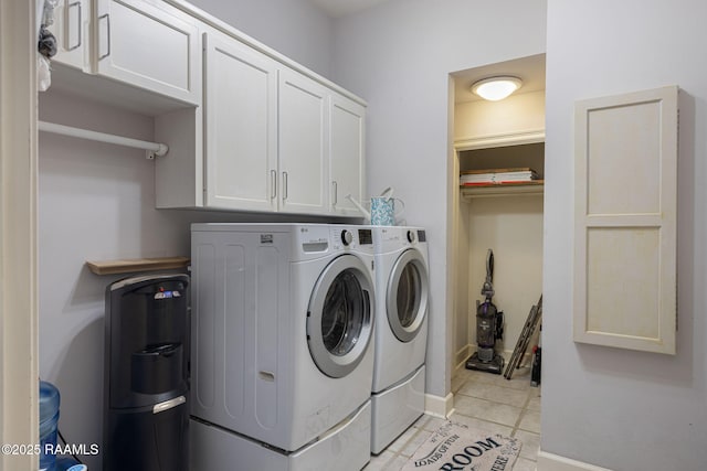 102 Capilano Ln, Broussard, LA 70518 - laundry area featuring washing machine and clothes dryer, cabinet space, and light tile patterned floors
