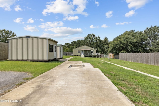 311 Grossie Dr, Lafayette, LA 70501 - view of yard with an outbuilding
