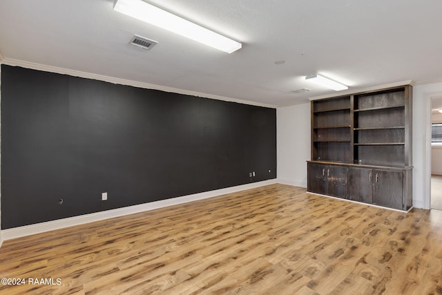 311 Grossie Dr, Lafayette, LA 70501 - spare room with crown molding, wood finished floors, and baseboards