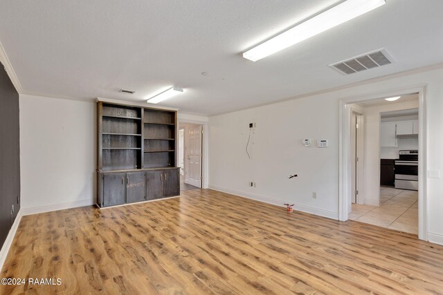 311 Grossie Dr, Lafayette, LA 70501 - unfurnished room featuring light wood-style floors, baseboards, and crown molding