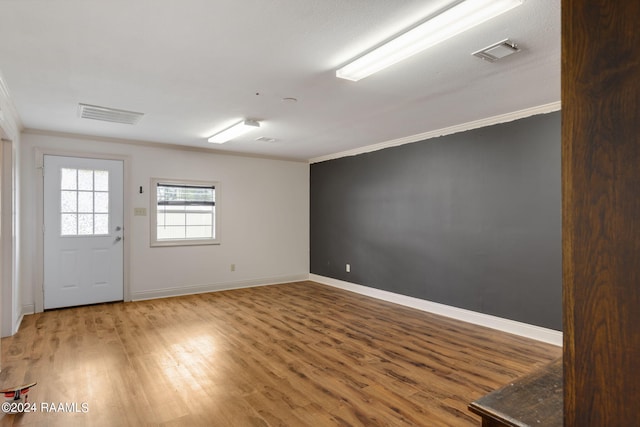 311 Grossie Dr, Lafayette, LA 70501 - empty room with ornamental molding, wood finished floors, and baseboards