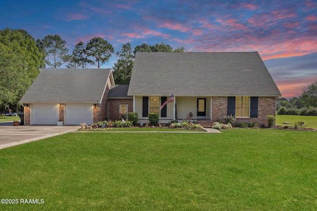 1714 Christopher Fox Ln, New Iberia, LA 70563 - view of front of house with brick siding, a yard, a garage, and driveway