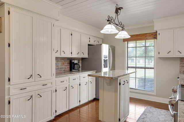 1714 Christopher Fox Ln, New Iberia, LA 70563 - kitchen with healthy amount of natural light, wood finished floors, stainless steel appliances, white cabinetry, and ornamental molding
