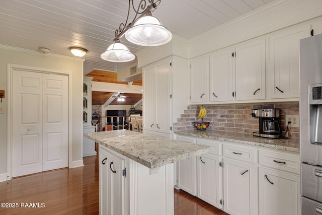 1714 Christopher Fox Ln, New Iberia, LA 70563 - kitchen featuring white cabinetry, tasteful backsplash, ornamental molding, stainless steel fridge, and dark wood finished floors