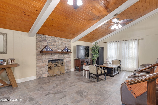 1714 Christopher Fox Ln, New Iberia, LA 70563 - living area featuring ceiling fan, a fireplace, wood ceiling, stone finish flooring, and baseboards