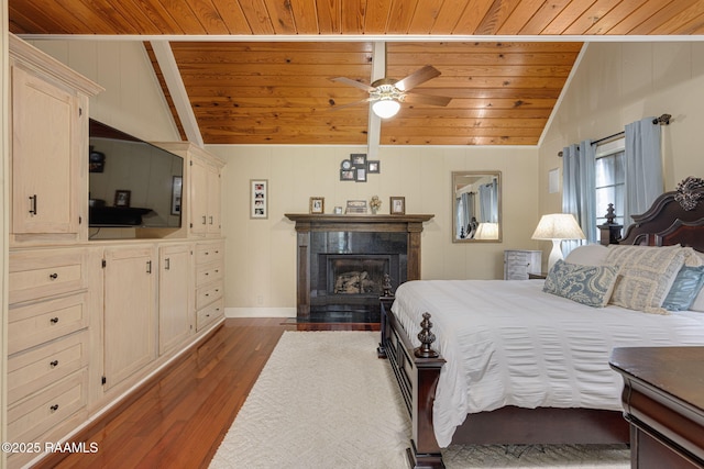 1714 Christopher Fox Ln, New Iberia, LA 70563 - bedroom with wooden ceiling, lofted ceiling, dark wood-type flooring, a glass covered fireplace, and baseboards