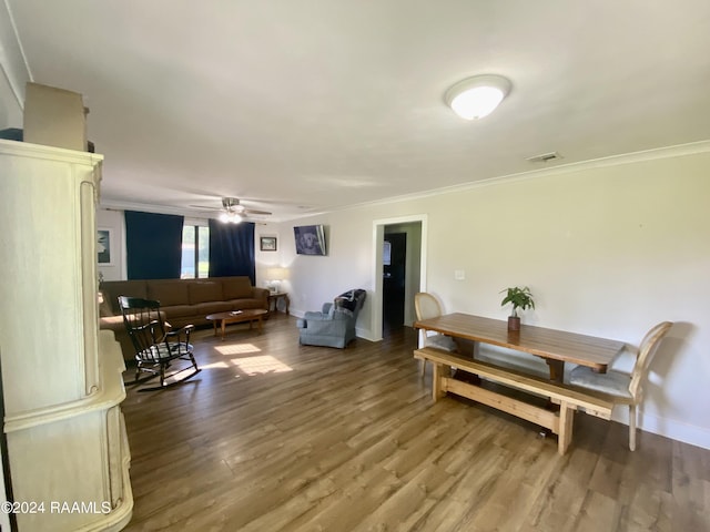 1034 Barras Rd, Saint Martinville, LA 70582 - living area with crown molding, wood finished floors, ceiling fan, and baseboards