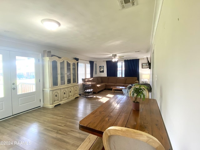 1034 Barras Rd, Saint Martinville, LA 70582 - dining area featuring french doors, crown molding, wood finished floors, and ceiling fan