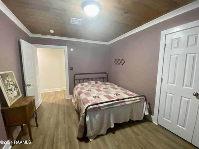 1034 Barras Rd, Saint Martinville, LA 70582 - bedroom featuring crown molding, wood finished floors, wood ceiling, and baseboards