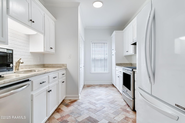 111 Jo Mar Rd, Lafayette, LA 70508 - kitchen featuring appliances with stainless steel finishes, decorative backsplash, ornamental molding, white cabinetry, and a sink