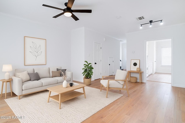 111 Jo Mar Rd, Lafayette, LA 70508 - living room featuring crown molding, a ceiling fan, light wood-style flooring, and baseboards
