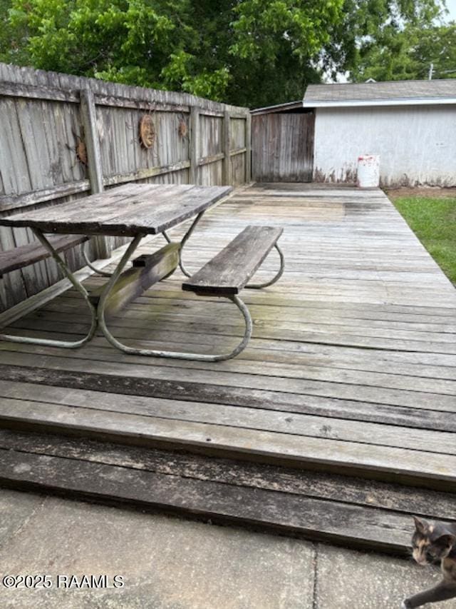 700 S State St, Abbeville, LA 70510 - wooden deck featuring outdoor dining area