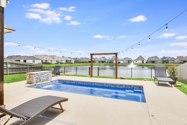 111 San Sebastian Dr, Youngsville, LA 70592 - view of swimming pool featuring a patio area, a residential view, a water view, and a fenced backyard