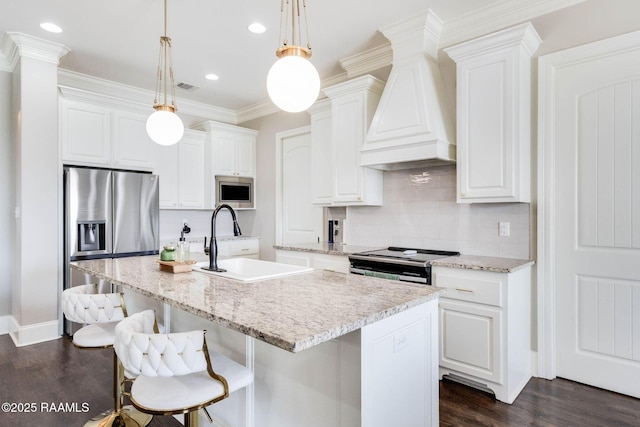 111 San Sebastian Dr, Youngsville, LA 70592 - kitchen with a sink, custom range hood, appliances with stainless steel finishes, dark wood-style flooring, and tasteful backsplash