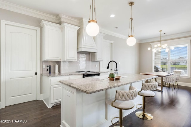 111 San Sebastian Dr, Youngsville, LA 70592 - kitchen with dark wood-type flooring, a sink, white cabinets, range, and crown molding