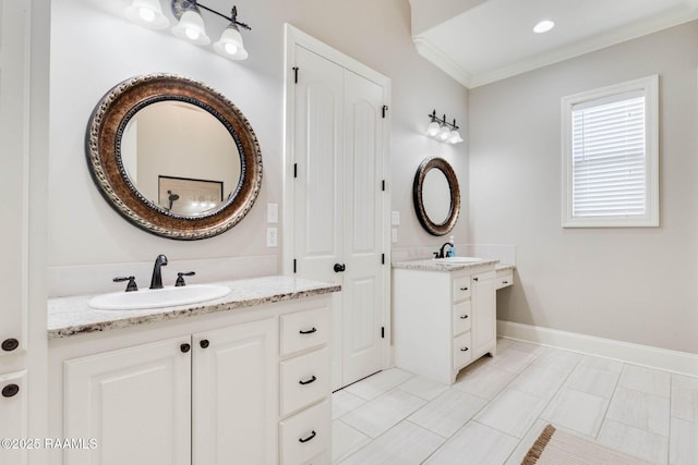 111 San Sebastian Dr, Youngsville, LA 70592 - bathroom with two vanities, ornamental molding, and tile patterned floors