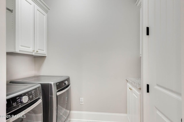 111 San Sebastian Dr, Youngsville, LA 70592 - washroom featuring cabinet space, separate washer and dryer, and baseboards