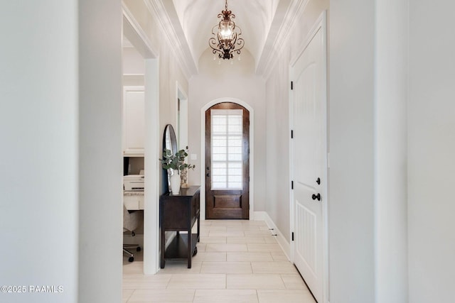 111 San Sebastian Dr, Youngsville, LA 70592 - foyer entrance with a chandelier, arched walkways, vaulted ceiling, and crown molding