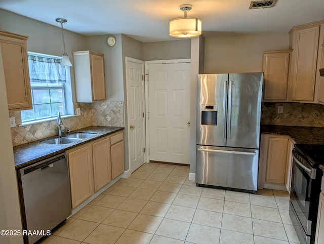 103 E Weeks Dr, Youngsville, LA 70592 - kitchen featuring stainless steel appliances, tasteful backsplash, and light tile patterned floors