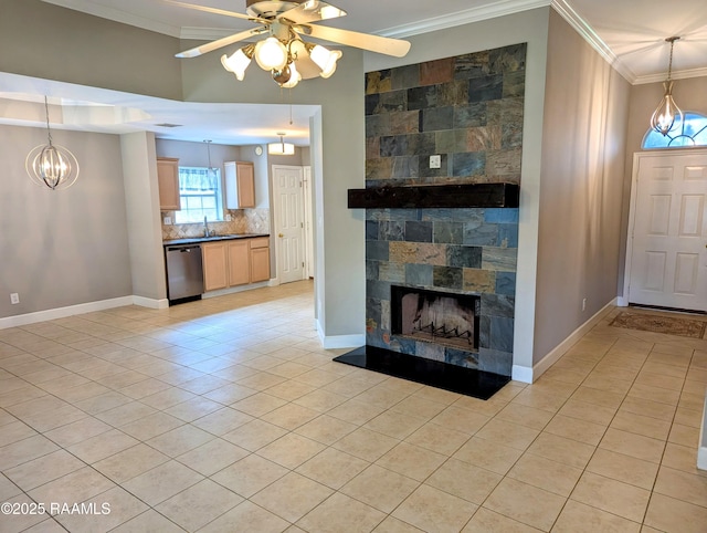 103 E Weeks Dr, Youngsville, LA 70592 - unfurnished living room with ornamental molding, light tile patterned floors, a ceiling fan, and baseboards