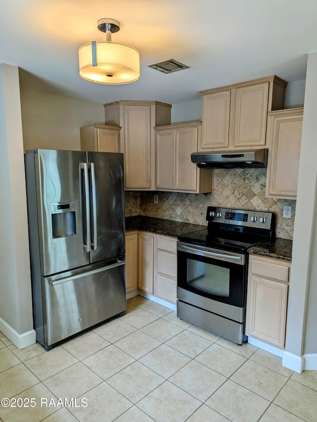 103 E Weeks Dr, Youngsville, LA 70592 - kitchen featuring stainless steel appliances, under cabinet range hood, backsplash, and light tile patterned floors
