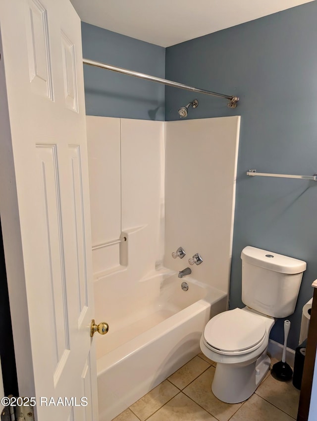 103 E Weeks Dr, Youngsville, LA 70592 - bathroom featuring tile patterned floors, shower / bathtub combination, and toilet