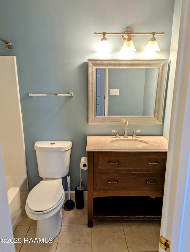 103 E Weeks Dr, Youngsville, LA 70592 - bathroom with vanity, toilet, and tile patterned floors