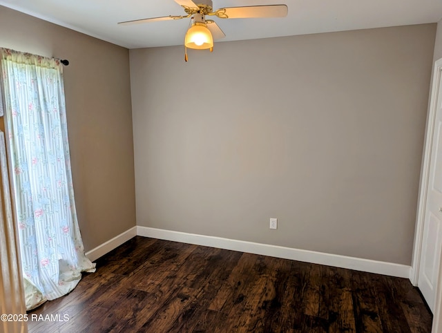 103 E Weeks Dr, Youngsville, LA 70592 - spare room featuring baseboards, dark wood-type flooring, and ceiling fan