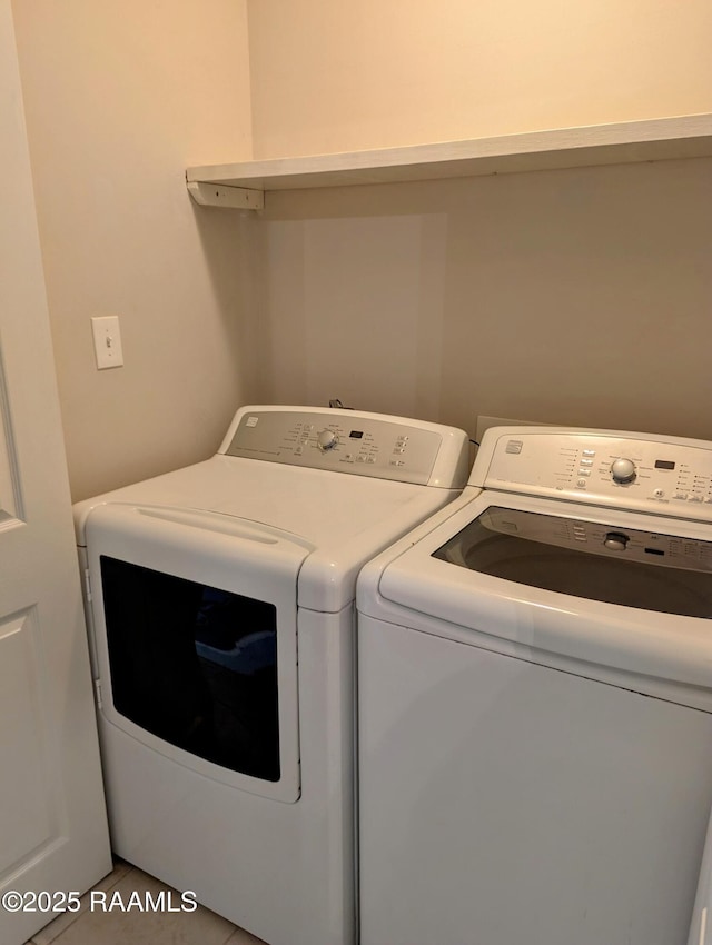 103 E Weeks Dr, Youngsville, LA 70592 - washroom featuring washer and clothes dryer and tile patterned flooring