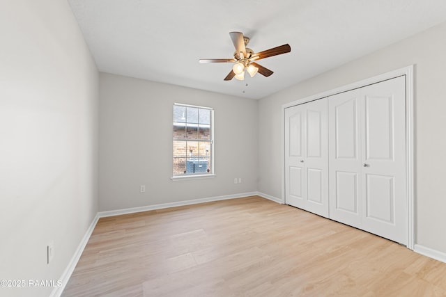 315 Kelso Dr, Carencro, LA 70520 - unfurnished bedroom with light wood-type flooring, baseboards, a closet, and ceiling fan