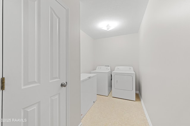 315 Kelso Dr, Carencro, LA 70520 - laundry room with washer and dryer, baseboards, and light colored carpet