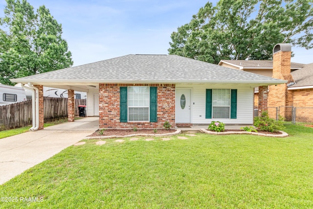 315 Kelso Dr, Carencro, LA 70520 - ranch-style house with roof with shingles, driveway, an attached carport, and brick siding