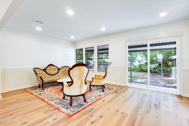 809 Saint Thomas St, Lafayette, LA 70506 - sitting room featuring ornamental molding, light wood finished floors, wainscoting, and recessed lighting