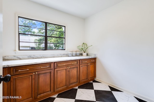 809 Saint Thomas St, Lafayette, LA 70506 - bathroom with marble finish flooring, plenty of natural light, and baseboards