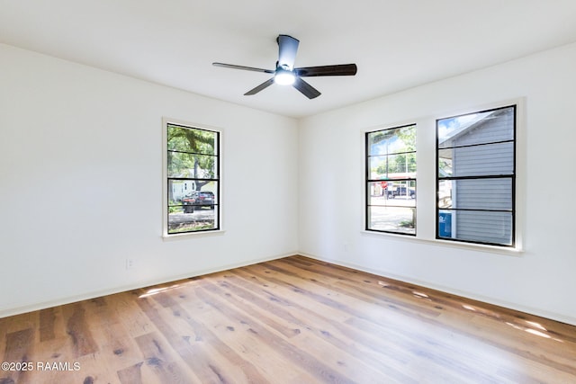 809 Saint Thomas St, Lafayette, LA 70506 - empty room with wood finished floors, a ceiling fan, and baseboards