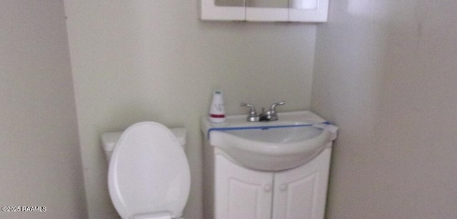 12017 Judge Doucet Rd, Abbeville, LA 70510 - half bath featuring vanity and toilet