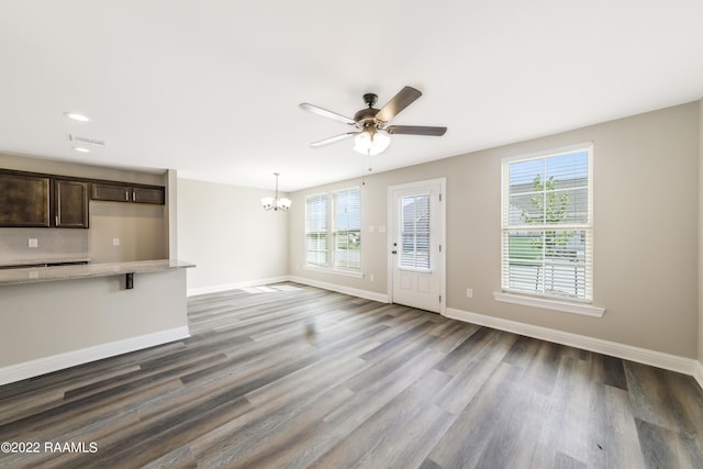 119 Sandstone Ave, Scott, LA 70583 - unfurnished living room with a chandelier, dark wood-style flooring, ceiling fan, baseboards, and recessed lighting