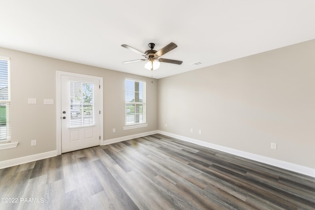 119 Sandstone Ave, Scott, LA 70583 - doorway with wood finished floors, a ceiling fan, and baseboards